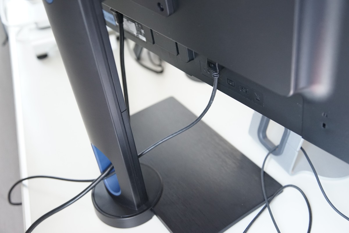 A desk with a monitor keyboard and mouse